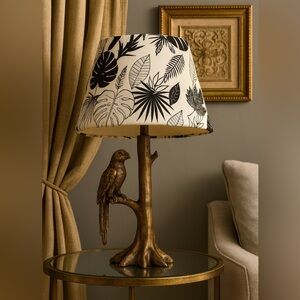 Black and White Tropical Leaf Print Lamp with Gold Parrot Bird Base